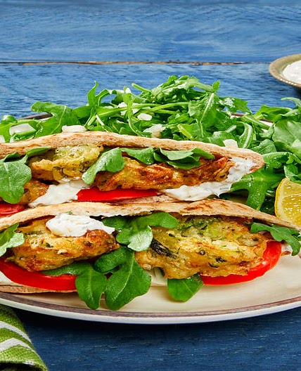 Zucchini & Feta Fritter Pita Pockets with Feta, Creamy Dill Sauce & Arugula Salad