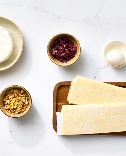 Baked Stuffed Brie with Cranberries & Walnuts