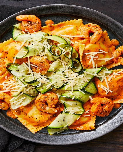 Shrimp with Lobster Ravioli in a Creamy Tomato Sauce with Zucchini Ribbons