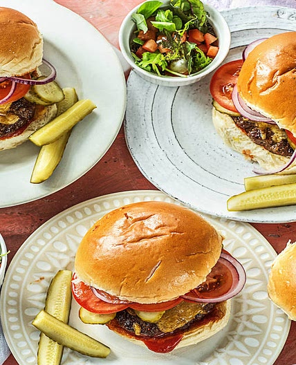 Cheddar Smash Burgers with Chipotle Ketchup, Green Salad, and Dill Pickles