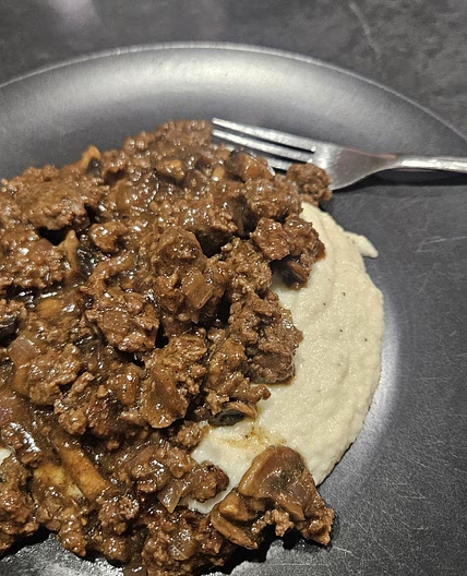 Beef gravy over cauliflower mash