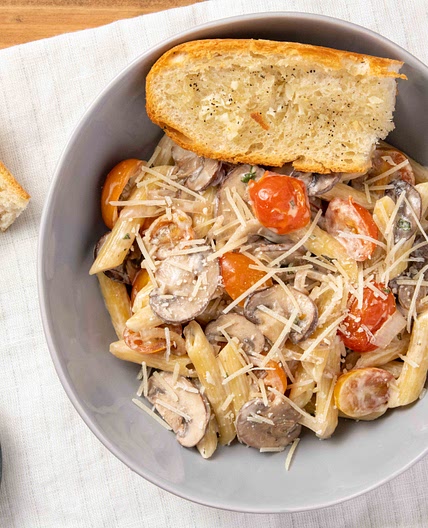 Mushroom Parmesan Penne Pasta with oregano and baguette