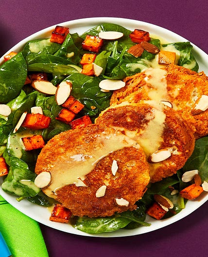 Savory Ricotta Fritters over a Spinach & Roasted Sweet Potato Salad