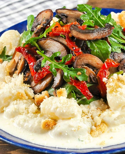 Gnocchi in Truffled Parmesan Cream with cremini mushrooms and sun-dried tomatoes