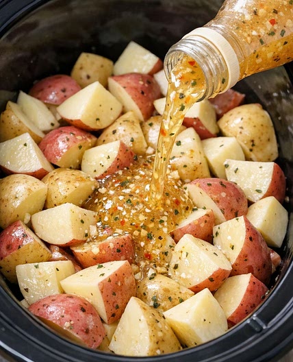 Dump this bottled Italian dressing and only 2 more ingredients over potatoes in the slow cooker for a simple, cozy side with a built-in veggie