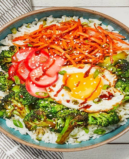 Broccoli-Carrot Donburi with a Fried Egg over Scallion Lime Rice with Pickled Radishes & Sesame Seeds