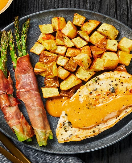 Buttery Garlic-Herb Chicken with Prosciutto-Wrapped Asparagus & Herbed Potatoes