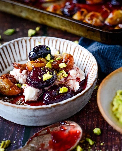 Labneh (Sweet and Savory) topped with baked grapes and pistachios