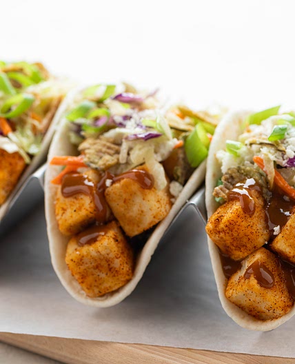 Crispy Carolina BBQ Tofu Tacos with green chili slaw and crispy jalapeños
