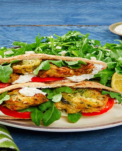 Zucchini & Feta Fritter Pita Pockets with Feta, Creamy Dill Sauce & Arugula Salad