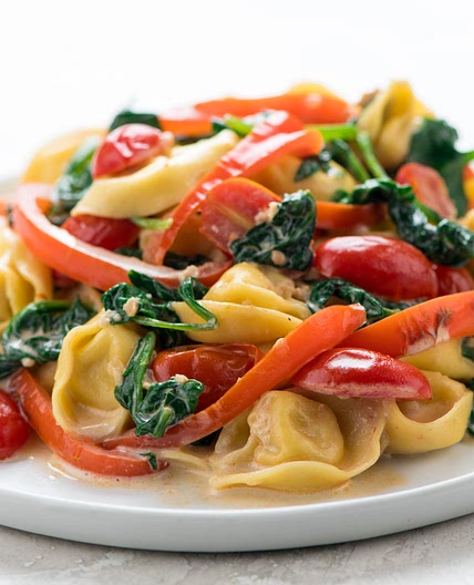 Creamy Tomato Parmesan Tortellini with spinach and red bell pepper