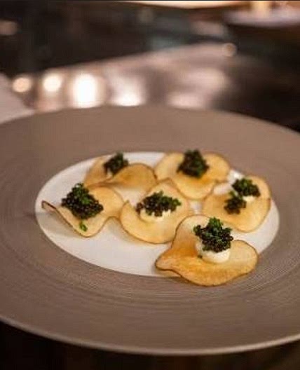 Caviar bite with craime fraîche and egg yolk and egg white