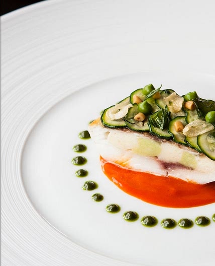 Chartreuse of Sea Bass with Scallop Mousse and "Liquid Gold" Saffron Consommé.