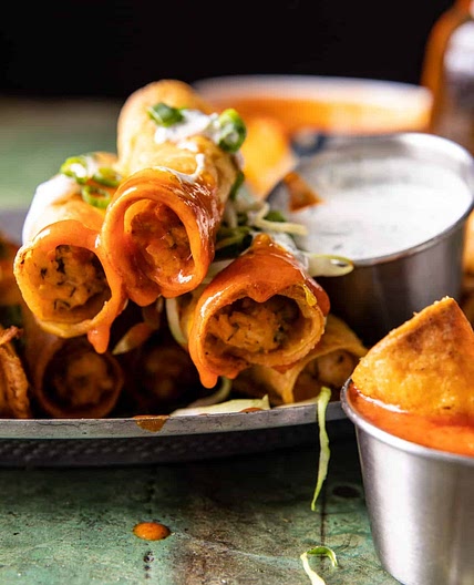 Jalapeño Cream Cheese Chicken Taquitos with Buffalo Sauce