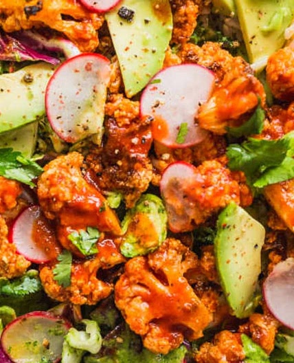 Recipe: Spicy Buffalo Cauliflower Bowls with Avocado and Green Tahini