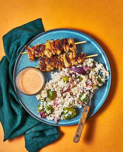 Honey-lime chicken skewers with charred veg rice, buttered corn cobettes & smoky mayo