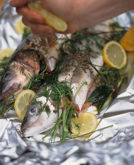 Whole sea bass baked in a bag & stuffed with herbs