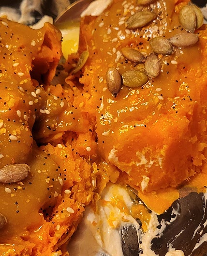 Tahini topped sweet potato with garlic yogurt