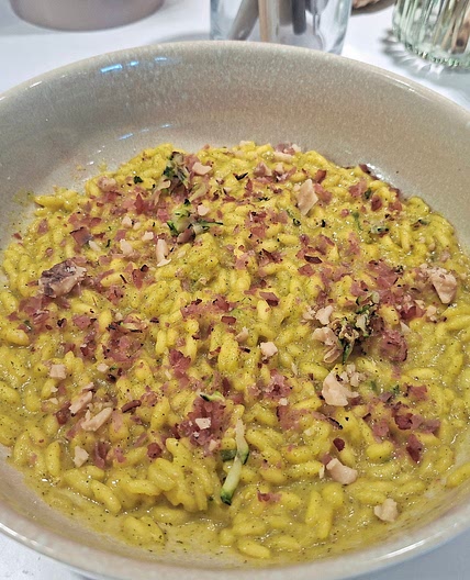 Risotto - Zucchini and saffron cream with crumbled speck and walnuts