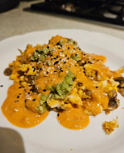 Garlic Mushroom Scramble with Smashed Avo and Spicy Peanut Drizzle