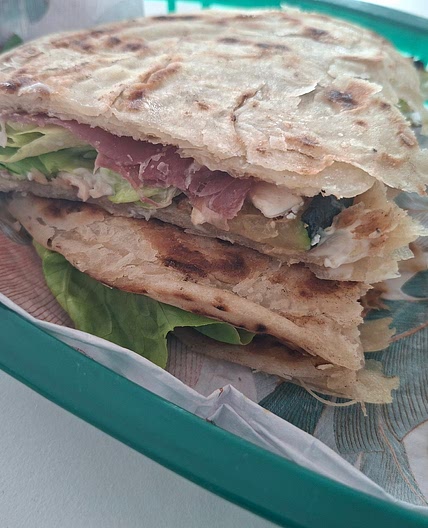 Piadina - Grilled zucchini, goat cheese and cured ham.