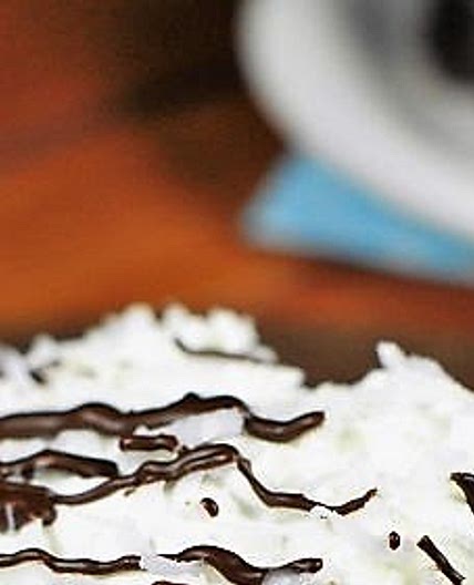Coconut Chocolate Poke Cake {with Coconut Whipped Cream Frosting}