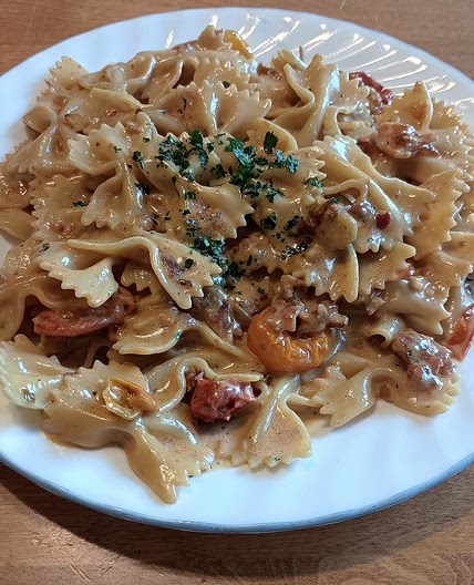 Creamy Pasta with Burst Tomatoes and Bacon Bits
