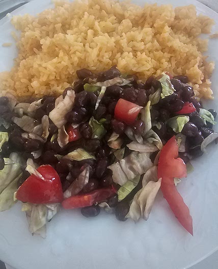 Rice and black beans, salad.