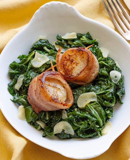Bacon-Wrapped Scallops with Garlic Swiss Chard