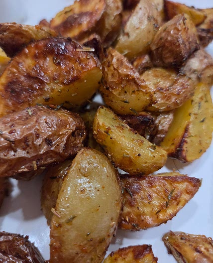 Seasoned aired fryer yellow potatoe wedges