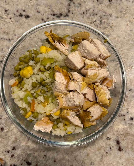 Chicken breast with rice and vegetables.