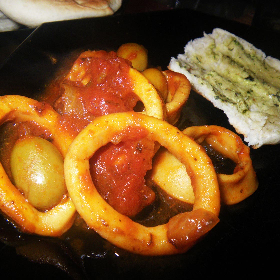 Squid Stewed With Tomatoes, White Wine and Black Olives