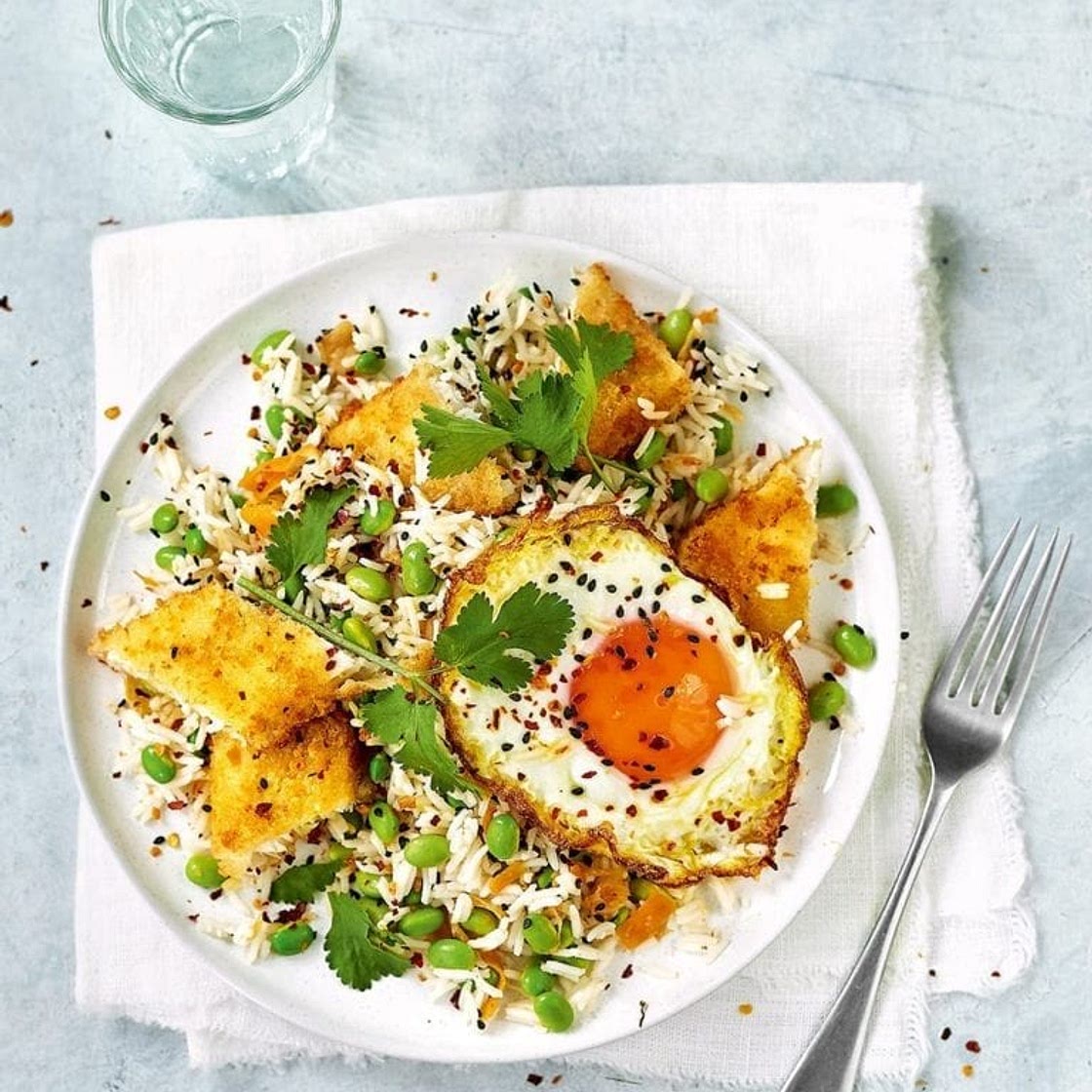 Fish finger kimchi rice with edamame and a fried egg