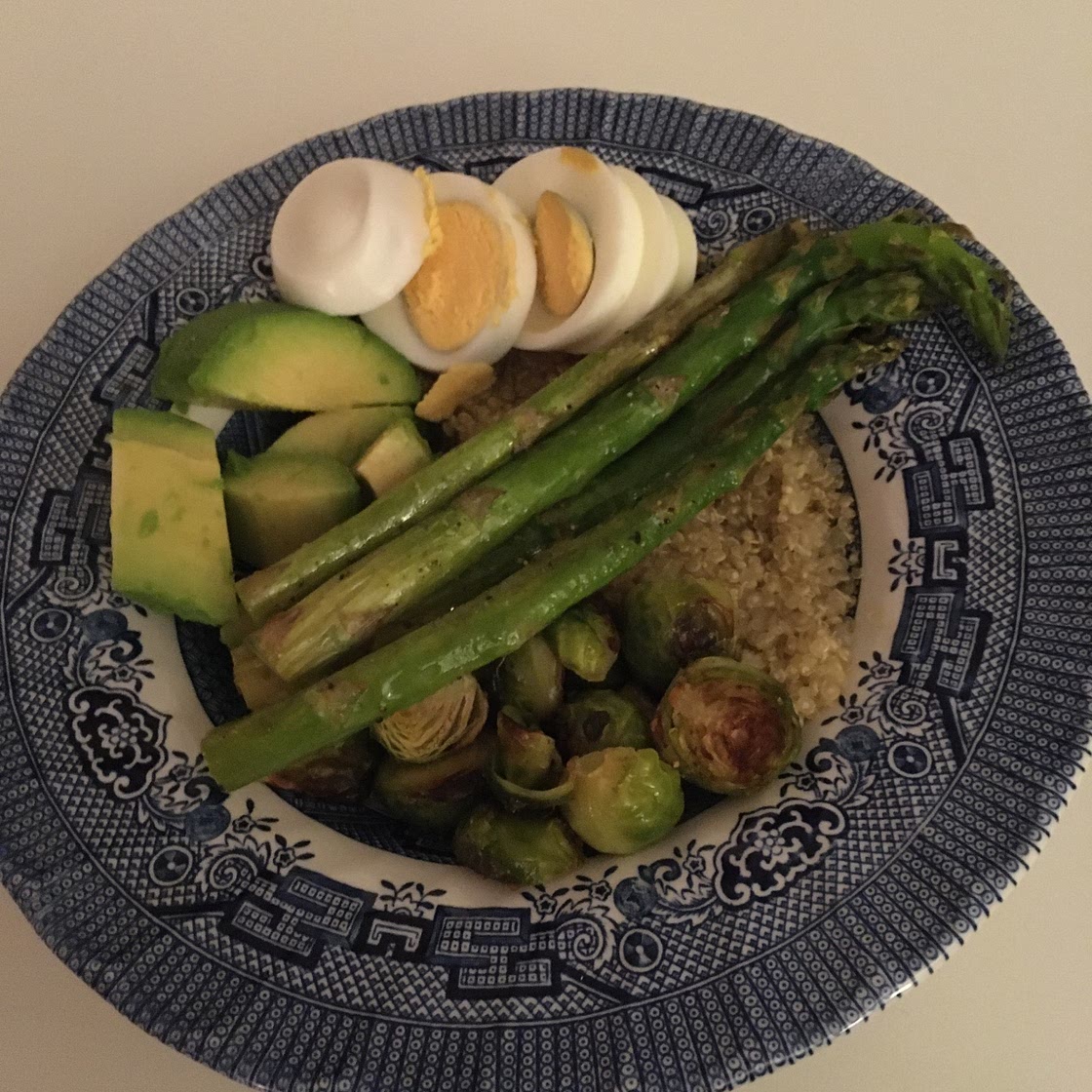 Quinoa bowl with asparagus and brussels sprouts