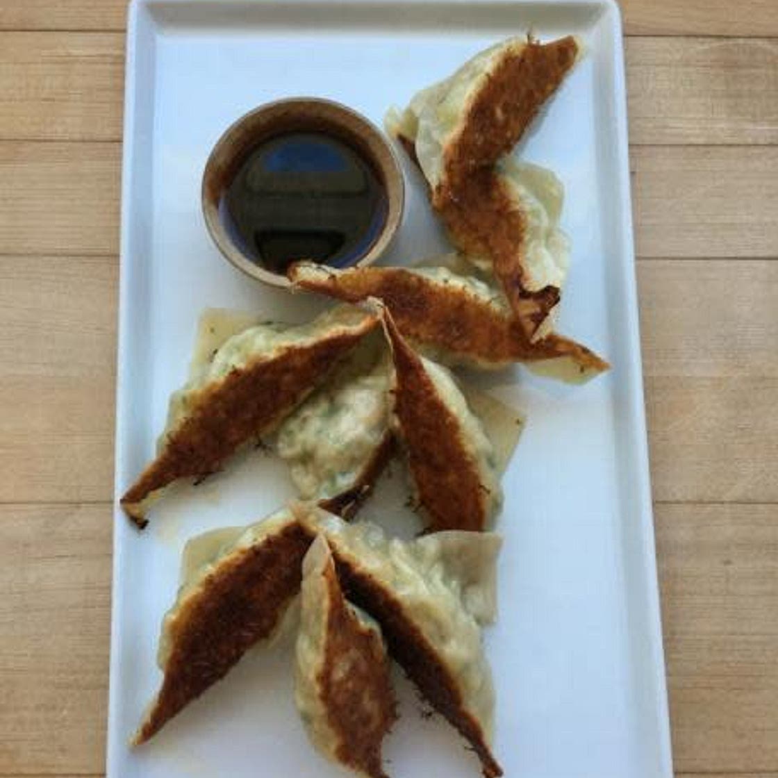 CHICKEN AND LEMONGRASS POTSTICKERS WITH PONZU DIPPING SAUCE