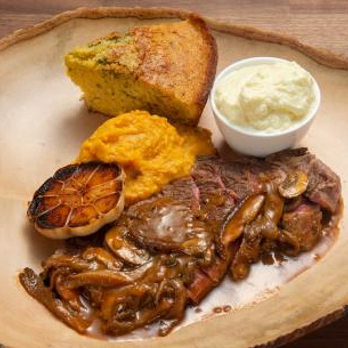 Buffalo Steaks with Sweet Potatoes, Cornbread and Gravy