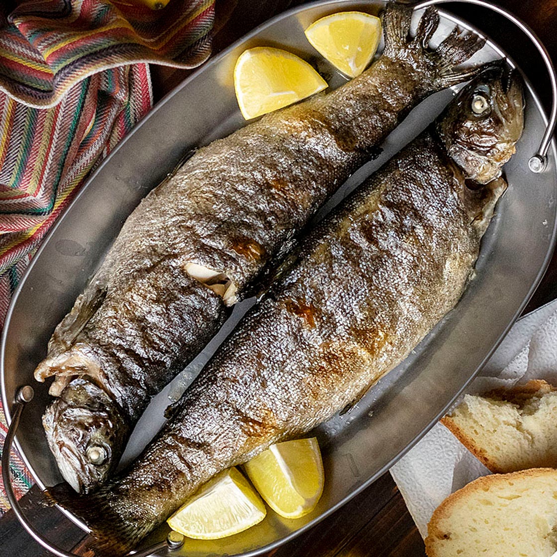 Simple broiled rainbow trout with dandelion greens