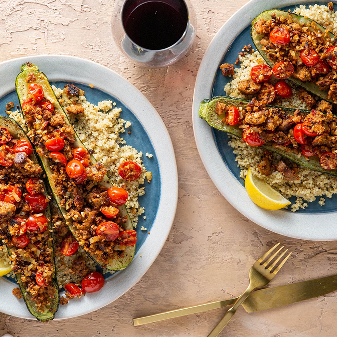 Tuscan Stuffed Zucchini with Herbed Sausage & Lemon Quinoa