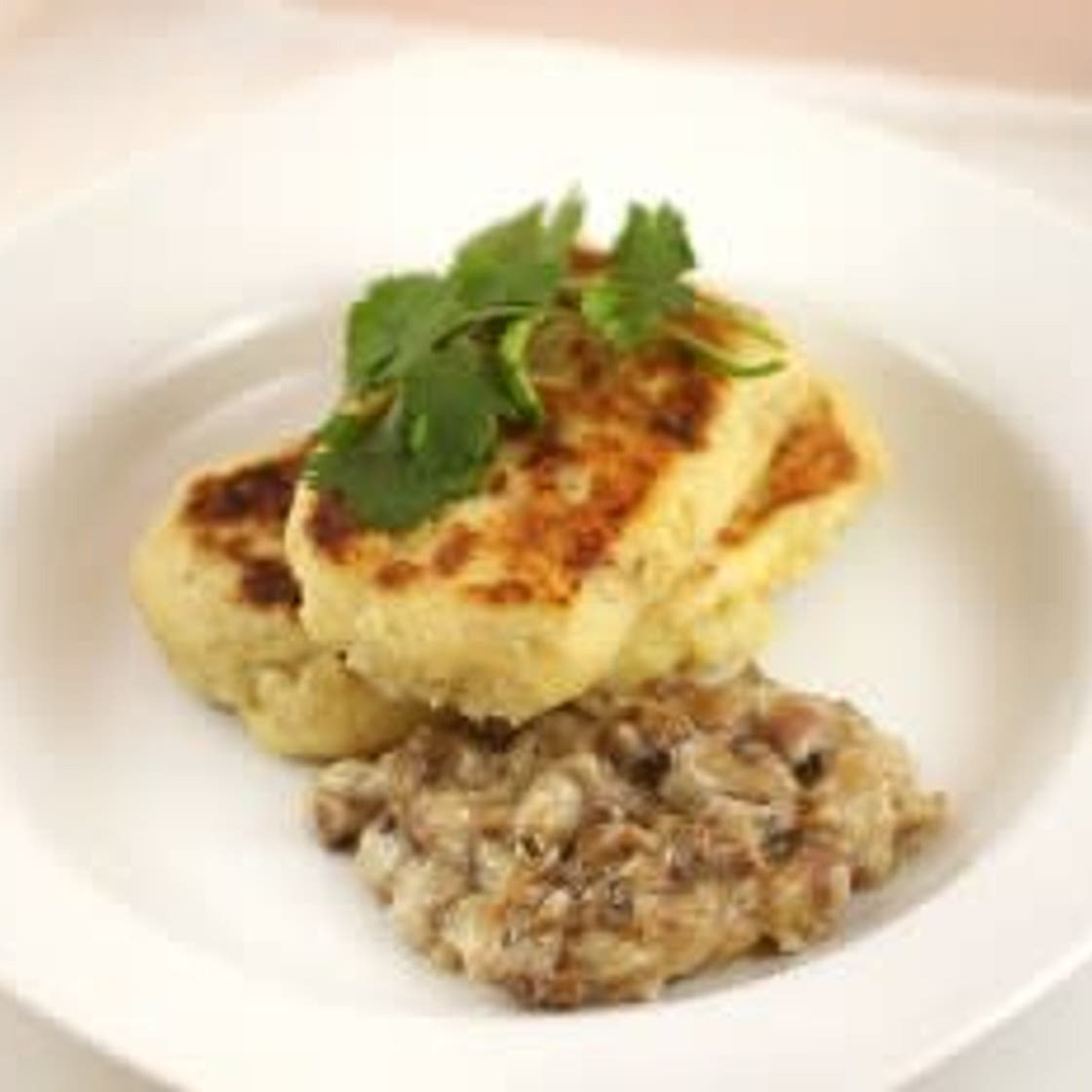 Kartofelniki with Meat in Mushroom Sauce