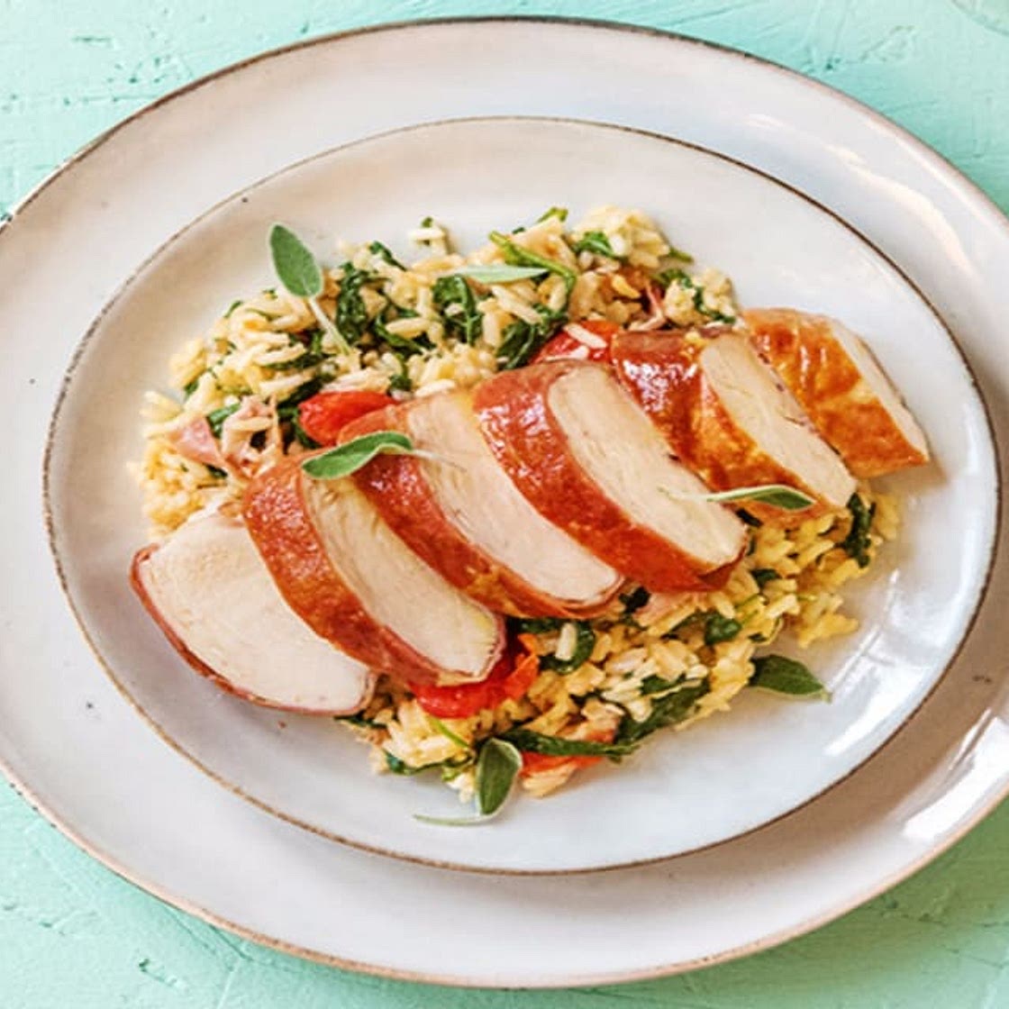 Prosciutto-Wrapped Chicken over Risotto Primavera