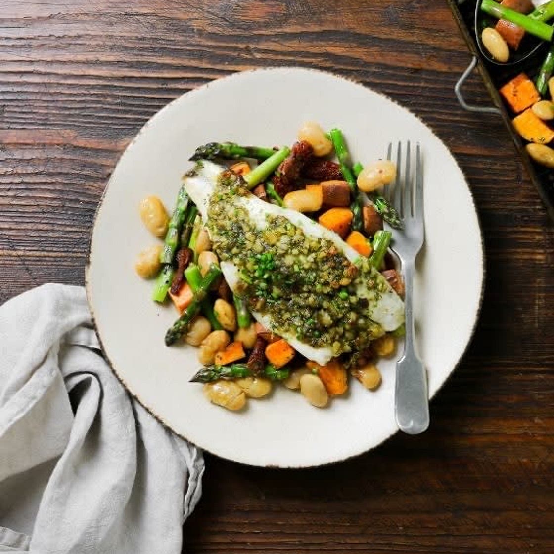 Balsamic roasted potatoes with asparagus, butter beans & seabass