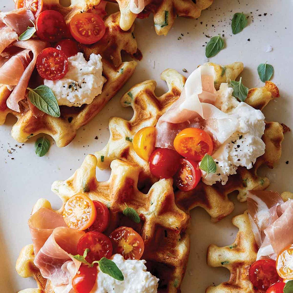 Savory Cheesy Herb Waffle Topped with Burrata, Tomato and Prosciutto