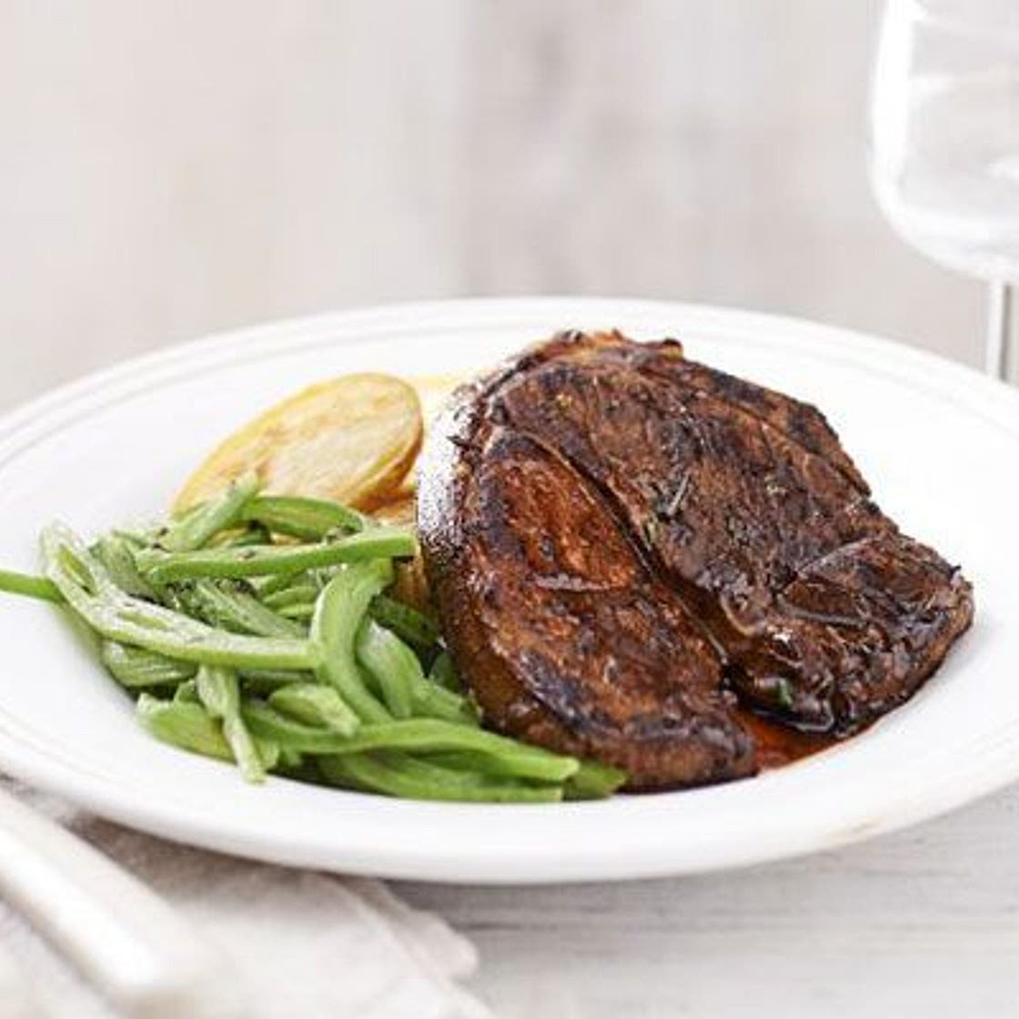Lamb steaks with crispy potatoes & minted beans