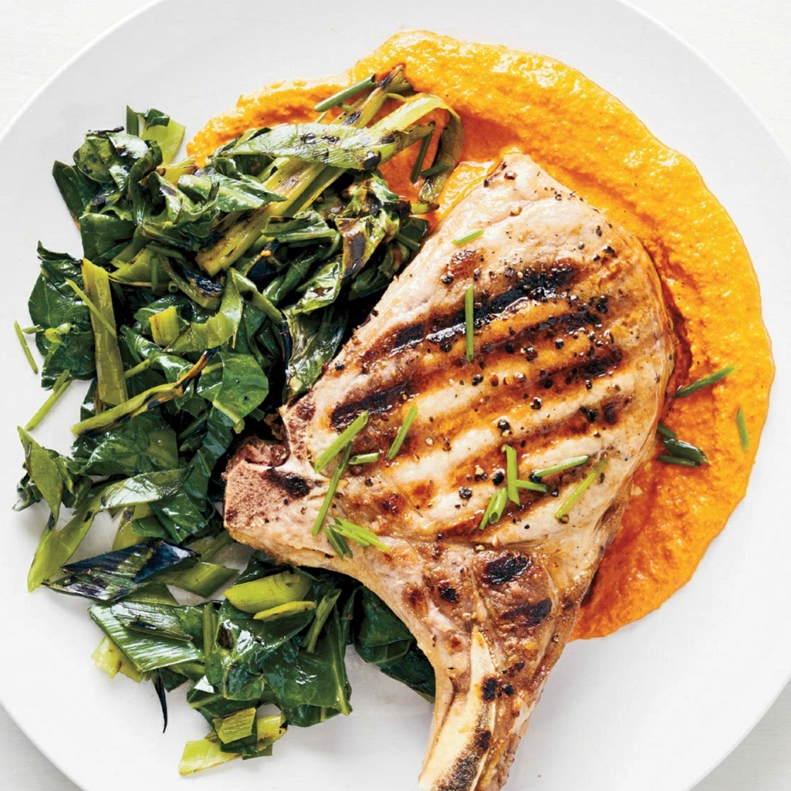 GRILLED PORK CHOPS AND GREENS WITH RED PEPPER SAUCE