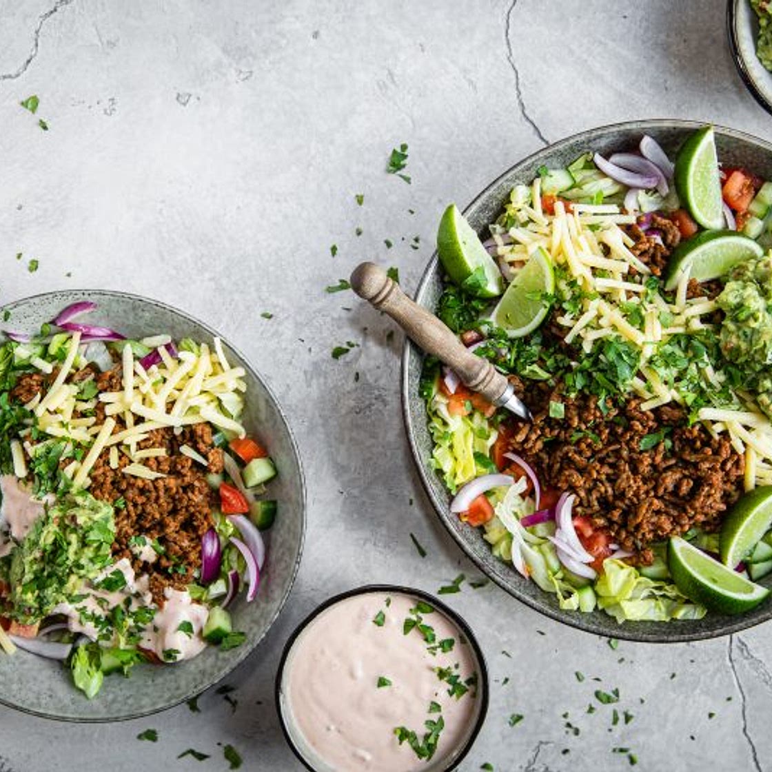 Keto taco salad with salsa dressing and guacamole