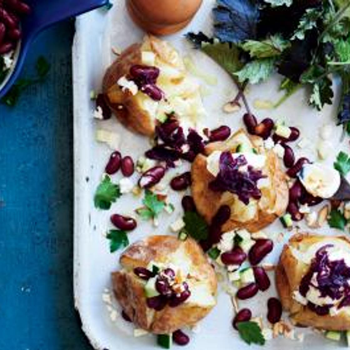 Baked potatoes with kidney beans, almonds & sauerkraut