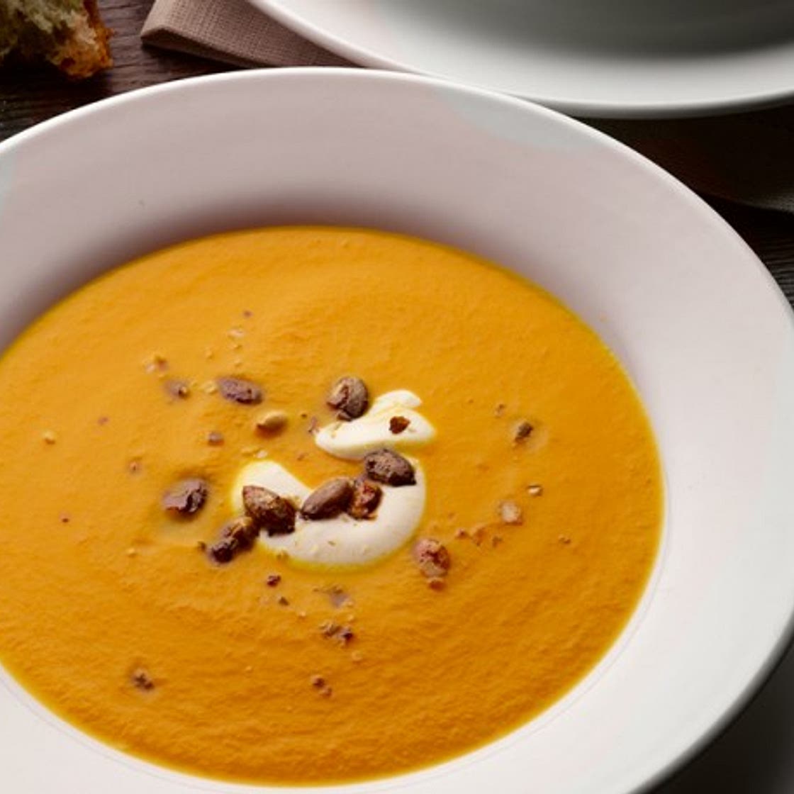 Pumpkin, saffron & orange soup with caramelised pumpkin seeds