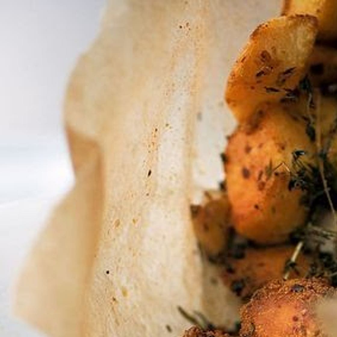Crack potatoes courtesy of Ottolenghi. Harissa and confit garlic roast potatoes