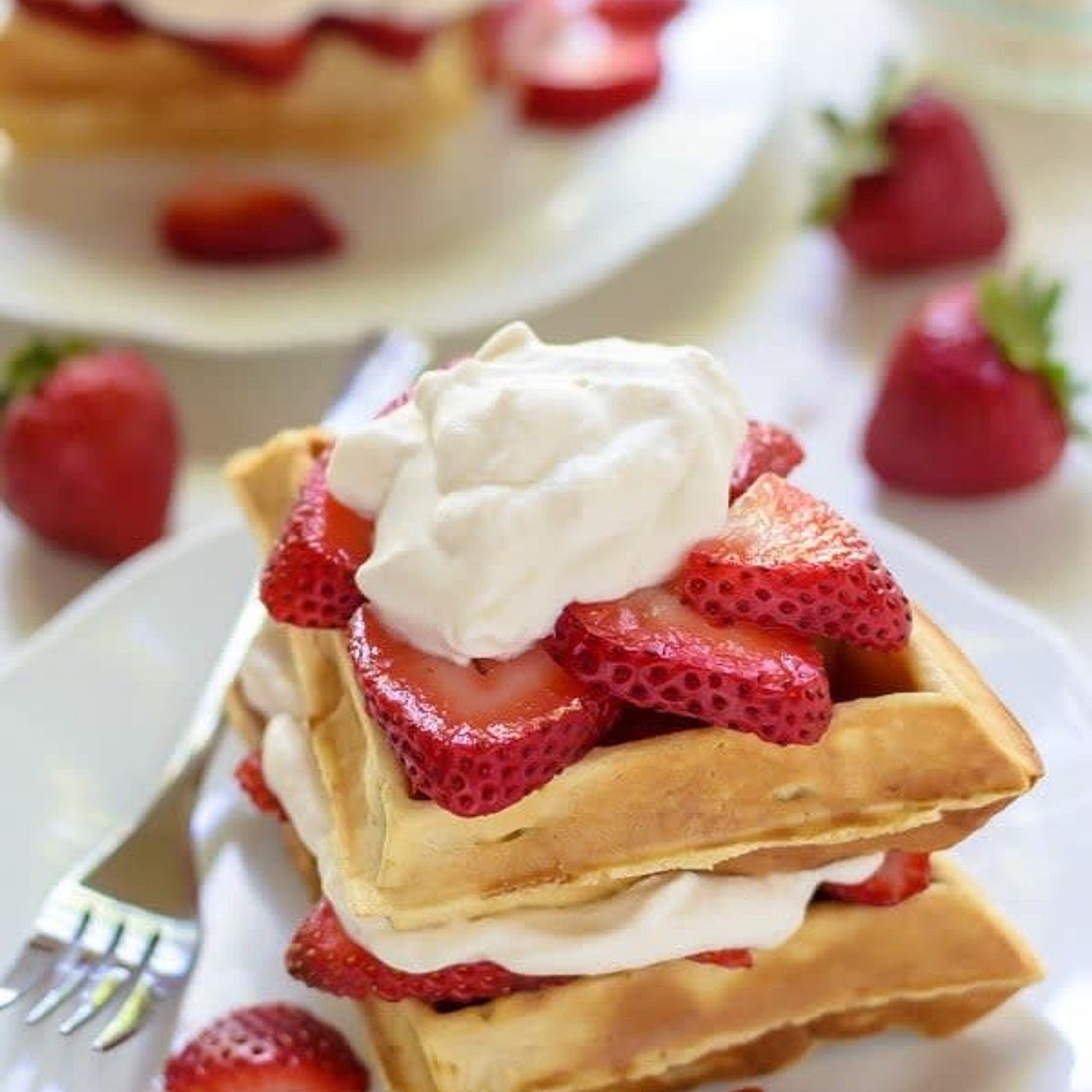 Waffles w/ wiped cream and strawberries