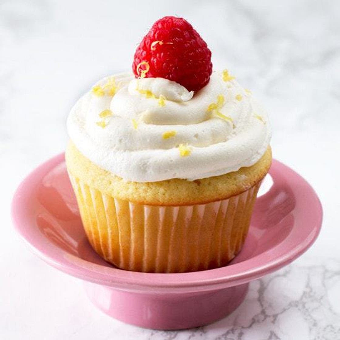 Lemon Raspberry-Filled Cupcakes with White Chocolate Buttercream Frosting